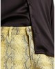 skinny leather-look pants in yellow snake print with zip detail